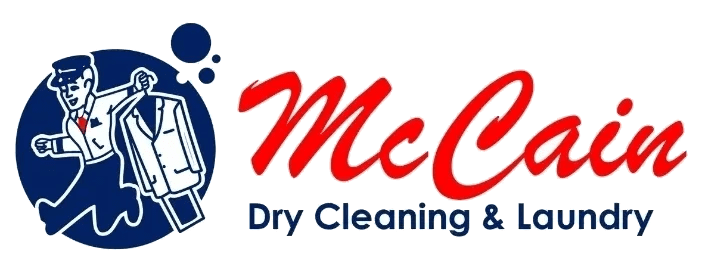 A green banner with the words " mccray dry cleaning & laundry."